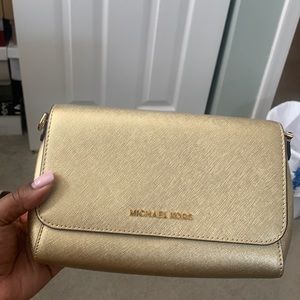 Small MK clutch/bag in Metallic gold